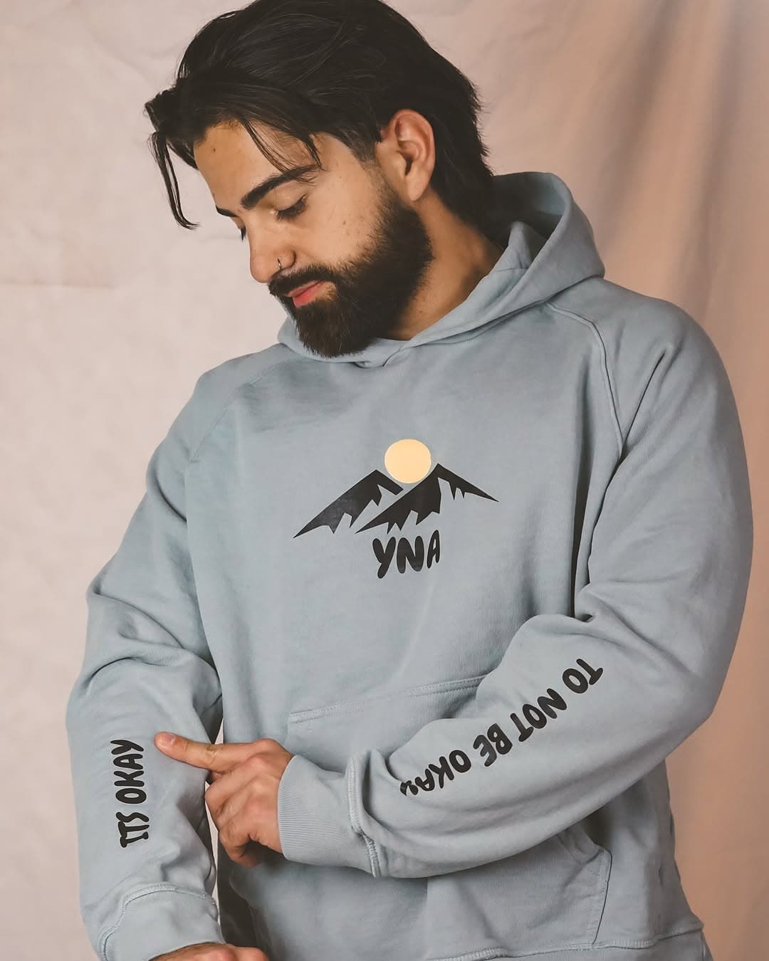 Sina Balouch wearing YNA hoodie